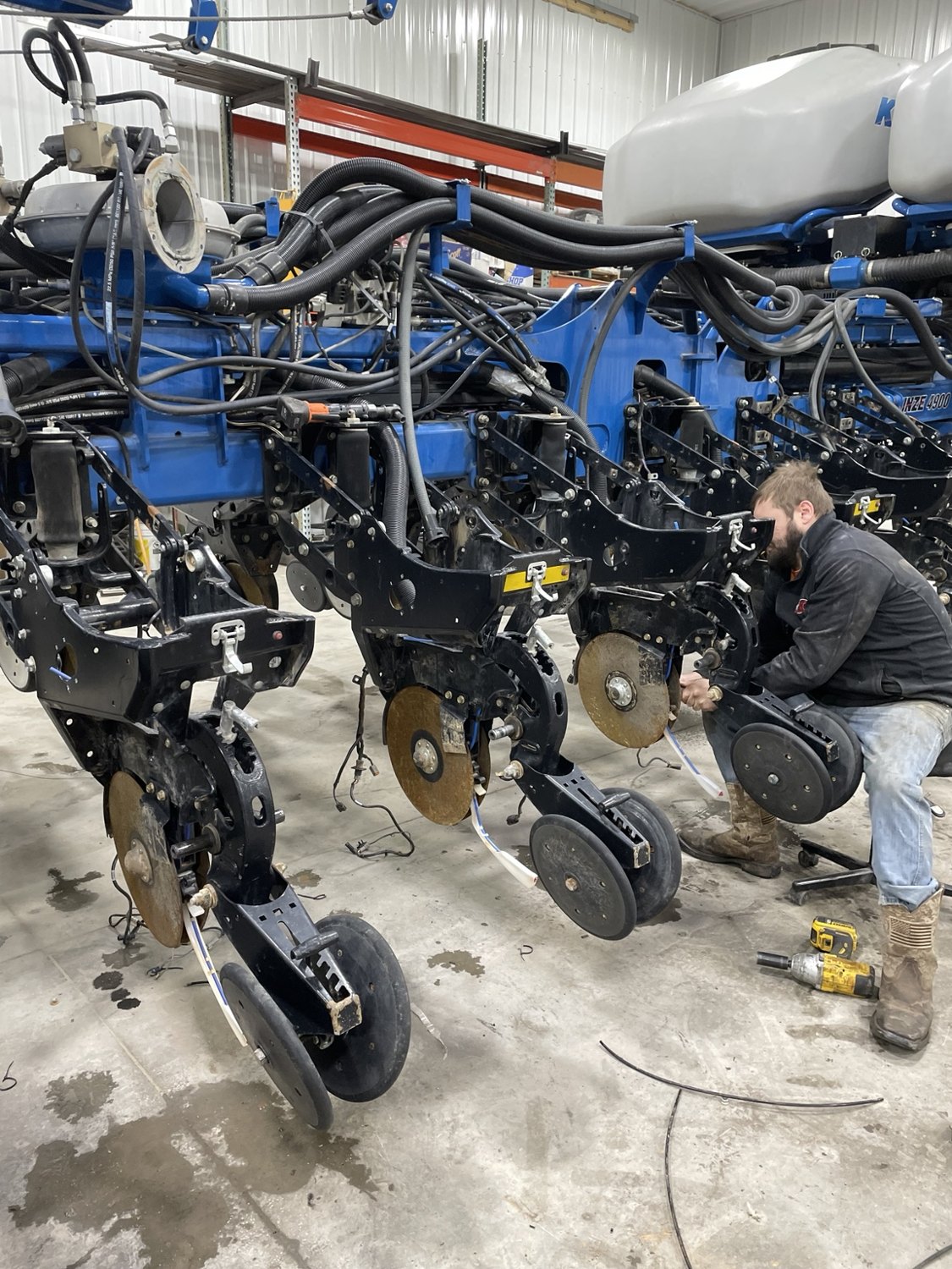 Technician working on a Kinze planter